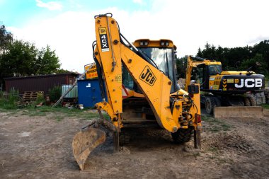 Lublin, Poland. 10 July 2022. Industrial excavator loader and buldozer on construction site