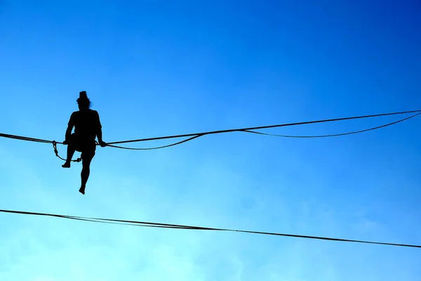 Lublin Poland July 2022 Silhouette Young Man Sitting Tightrope Urban — стоковое фото