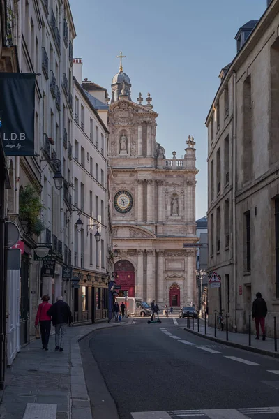 The Saint-Paul Saint-Louis Catholic church at the End of a Small Tradional Parisian Street in Paris, France
