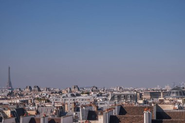 View of the Parisian Skyline with Eiffel Tower and Traditional Roofs and Chimneys from the Top of the Centre Pompidou in Paris, France