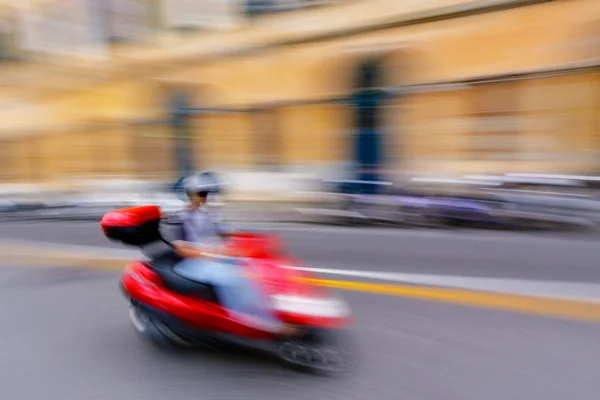 Red bike in motion — Stock Photo, Image