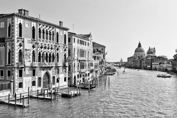 Monochrome image of the Grand Canal and Basilica di Maria della Salute looking from the Accademia Bridge towards San Marco Basin in Venice, Italy
