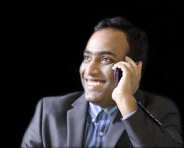 A handsome man talking on cell phone
