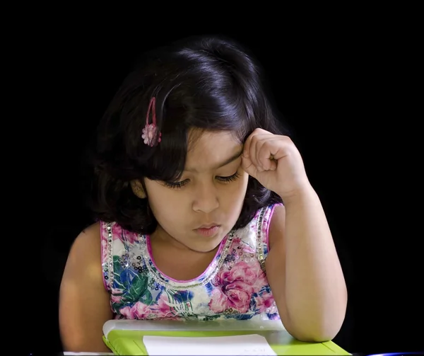 A cute girl is writing her math — Stock Photo, Image