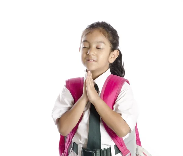 Uma menina bonita orando na escola — Fotografia de Stock