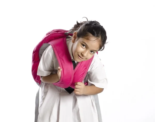 Una niña cansada de levantar bolsas pesadas — Foto de Stock