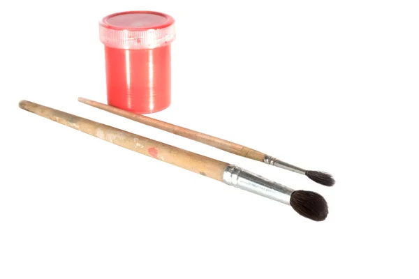 Red paint and old brushes — Stock Photo, Image