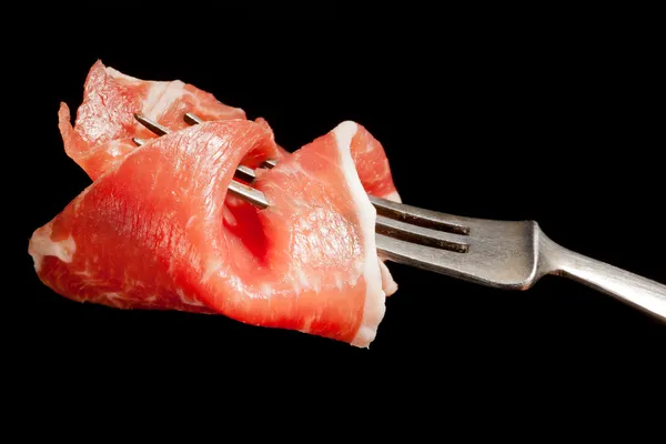 Delicious parma ham on fork. — Stock Photo, Image