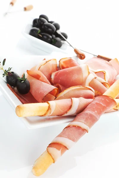 Luxusní prosciutto šunka pozadí. — Stock fotografie