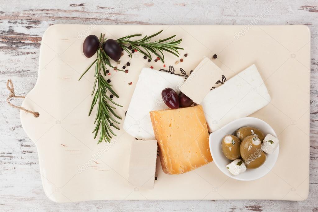 Cheese and olives. Luxurious appetizer.