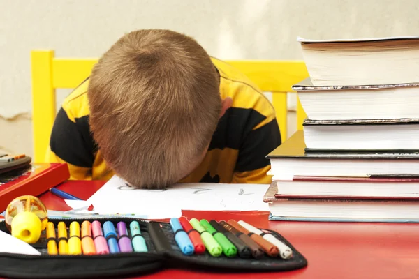 Boy sleeping over homework. — Stock Photo, Image