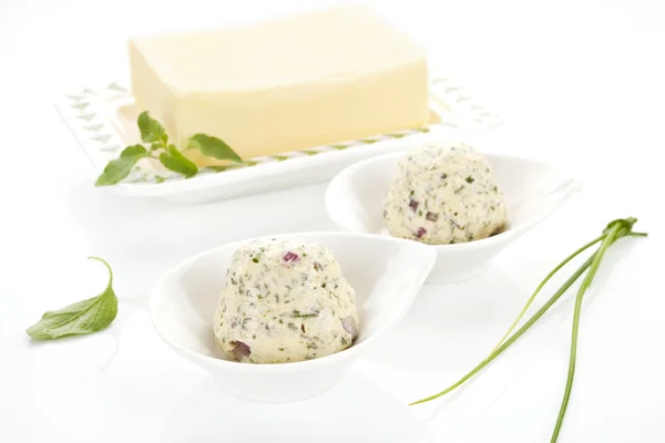 Dairy products. Butter and herbal butter on white background. — Stock Photo, Image