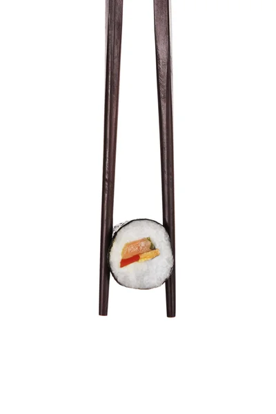 Sushi. Holding maki sushi with chopsticks. — Stock Photo, Image