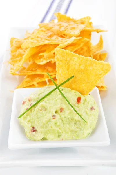 Nachos with guacamole dip. — Stock Photo, Image