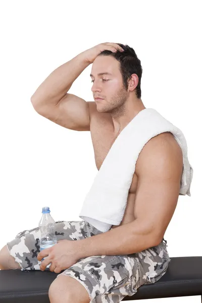 Sexy athlete resting after workout. — Stock Photo, Image