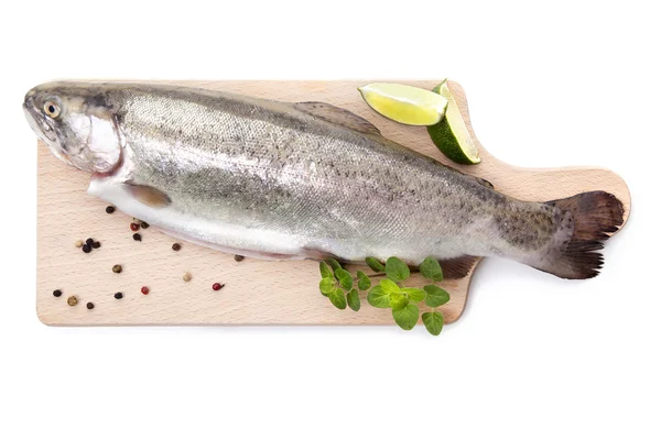 Fresh trout on wooden kitchen board. — Stock Photo, Image