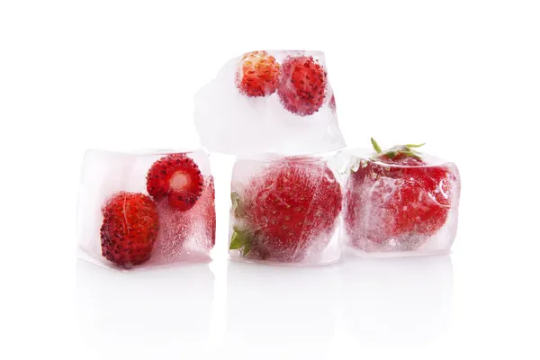 Frozen strawberries in ice cubes. — Stock Photo, Image