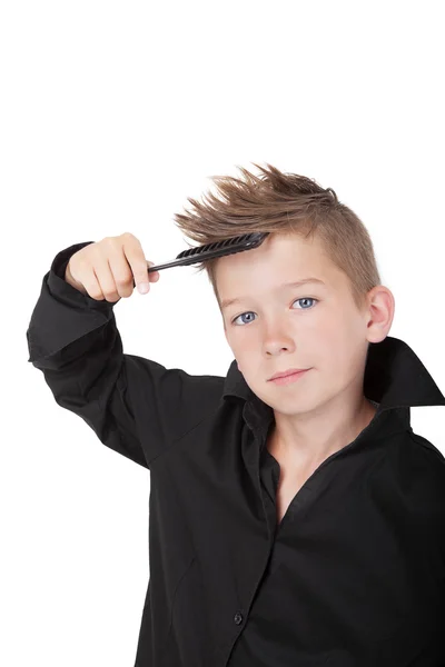 Boy brushing hair. — Stock Photo, Image