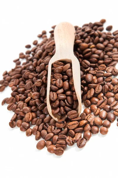 Coffee beans on wooden scoop. — Stock Photo, Image