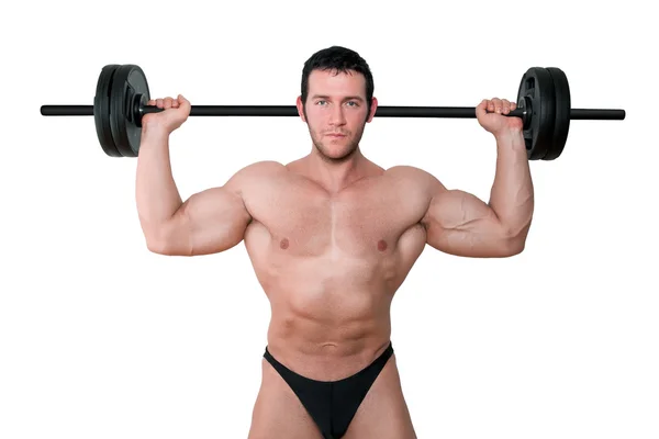 Bodybuilder mit Langhantel isoliert. — Stockfoto