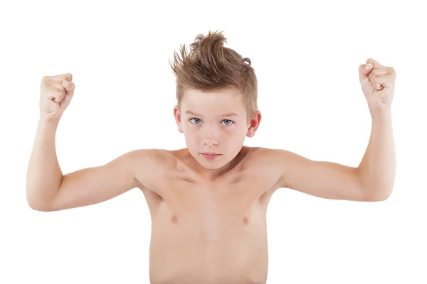Charmanter Junge zeigt Muskeln. — Stockfoto
