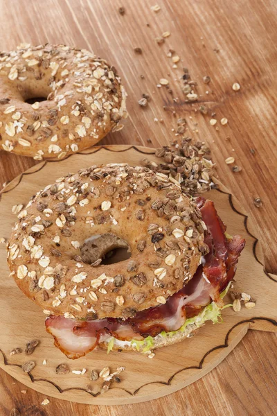 Bagel with bacon. — Stock Photo, Image