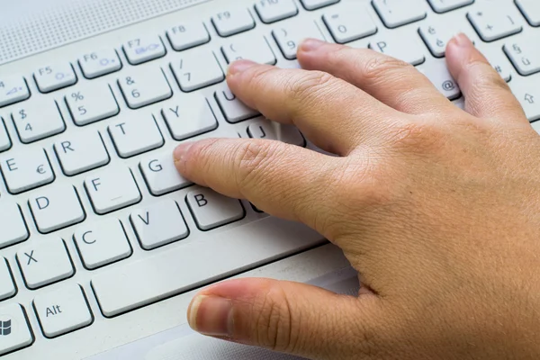 Woman\'s hand on keyboard