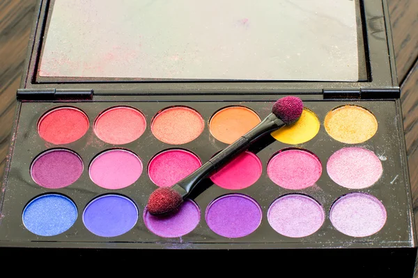 Woman with colorful makeup brush — Stock Photo, Image