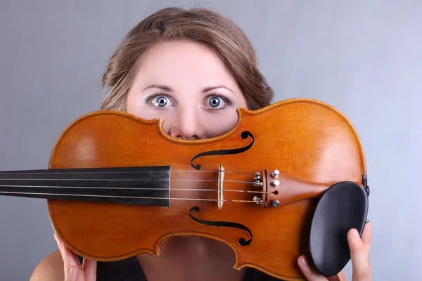 Beautiful girl with a violin in hands — Stock Photo, Image