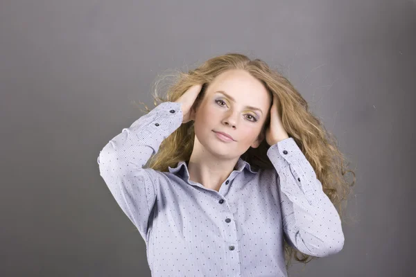 Charming blonde with beautiful make-up on gray background — Stock Photo, Image