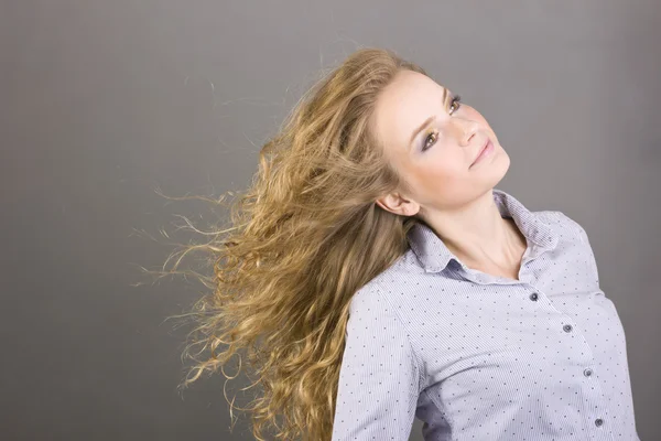 Charming blonde with beautiful make-up on gray background — Stock Photo, Image