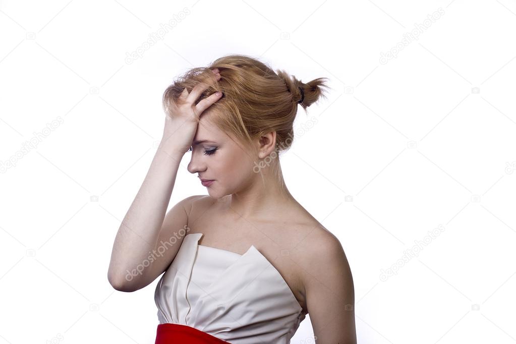 Beautiful emotional blonde in short dress on white background