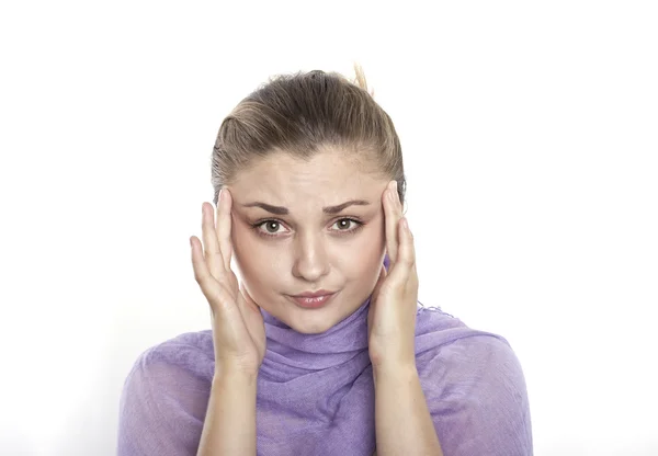 Young girl suffering from a headache. Isolated on white — Stock Photo, Image