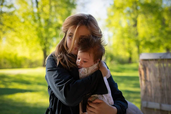Young Woman Holds Baby Her Arms Outdoor — Stock Photo, Image