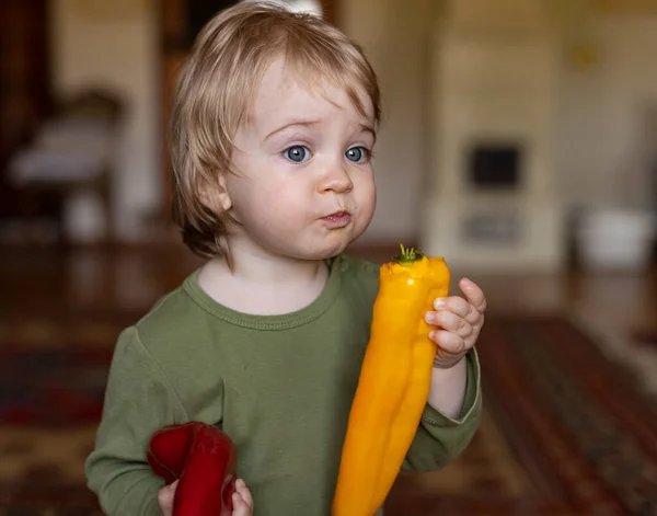 Little Child Eats Yellow Paper Home — Stock Photo, Image