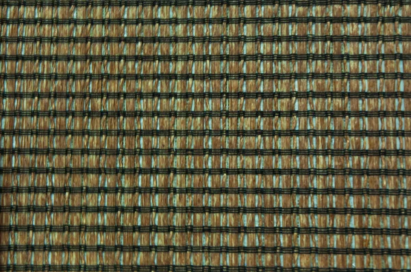 Mat weave with wood and black silk — Stock Photo, Image
