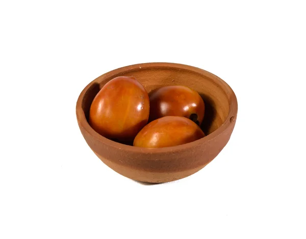 Tomato in bake clay bowl — Stock Photo, Image