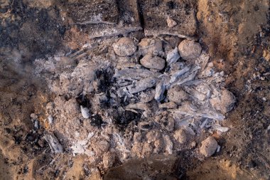 camping fire for grill with coal and ash very hot ready for grilling, campfire on the sand view of the campfire from above picnic time