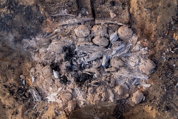 camping fire for grill with coal and ash very hot ready for grilling, campfire on the sand view of the campfire from above picnic time