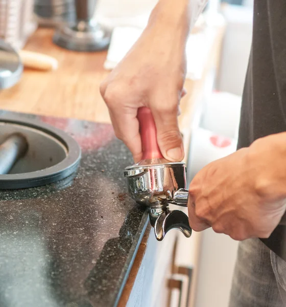 Barista prepares espresso in his coffeeshop — Stock Photo, Image