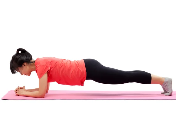 Mujer haciendo ejercicio de tablón — Foto de Stock