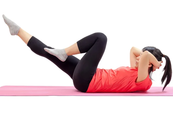 Mujer haciendo ejercicios abdominales — Foto de Stock