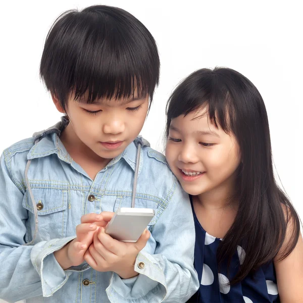 Kids playing on smartphone — Stock Photo, Image