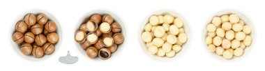 Macadamia fındıkları, beyaz kaselerde. Kurutulmuş fındık kabuğu ile meyveler, açılış anahtarı ile açıldı, kabuklu ve çiğ, ve kavrulmuş ve tuzlanmış. Queensland, Bush, Maroochi, Bauple ve Hawaii fıstıkları olarak da bilinir..