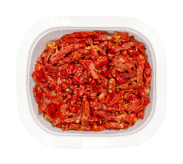 Sun dried tomatoes, in a white punnet, isolated from above. Red ripe plum tomatoes, cut into Julienne strips, salted and then dried in the sun of Sicily. High in lycopene, antioxidants and vitamin C.