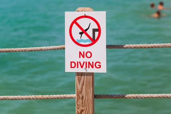 No diving sign on the pier — Stock Photo, Image