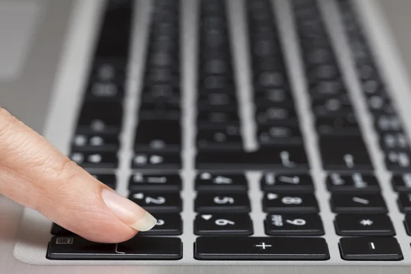 Woman pressing enter key — Stock Photo, Image