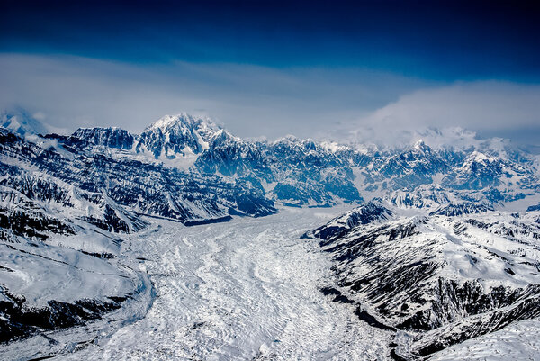 Aerial View of a Craggy Snow Covered Alaskan Mountain Range