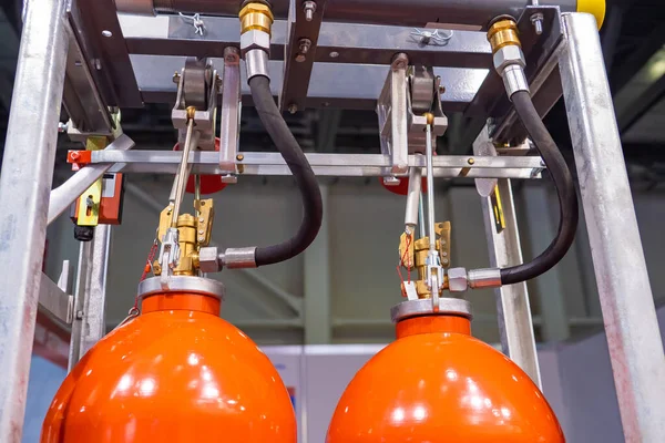 Industrial automatic fire extinguishing system. Balloons of an automatic fire extinguishing system. Cabinet with balloon of fire-fighting foam. Industrial flame extinguishing system close up