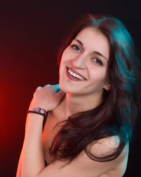 Beautiful woman in red and blue light — Stock Photo, Image